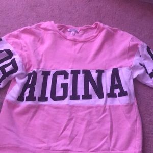 a light pink sweatshirt